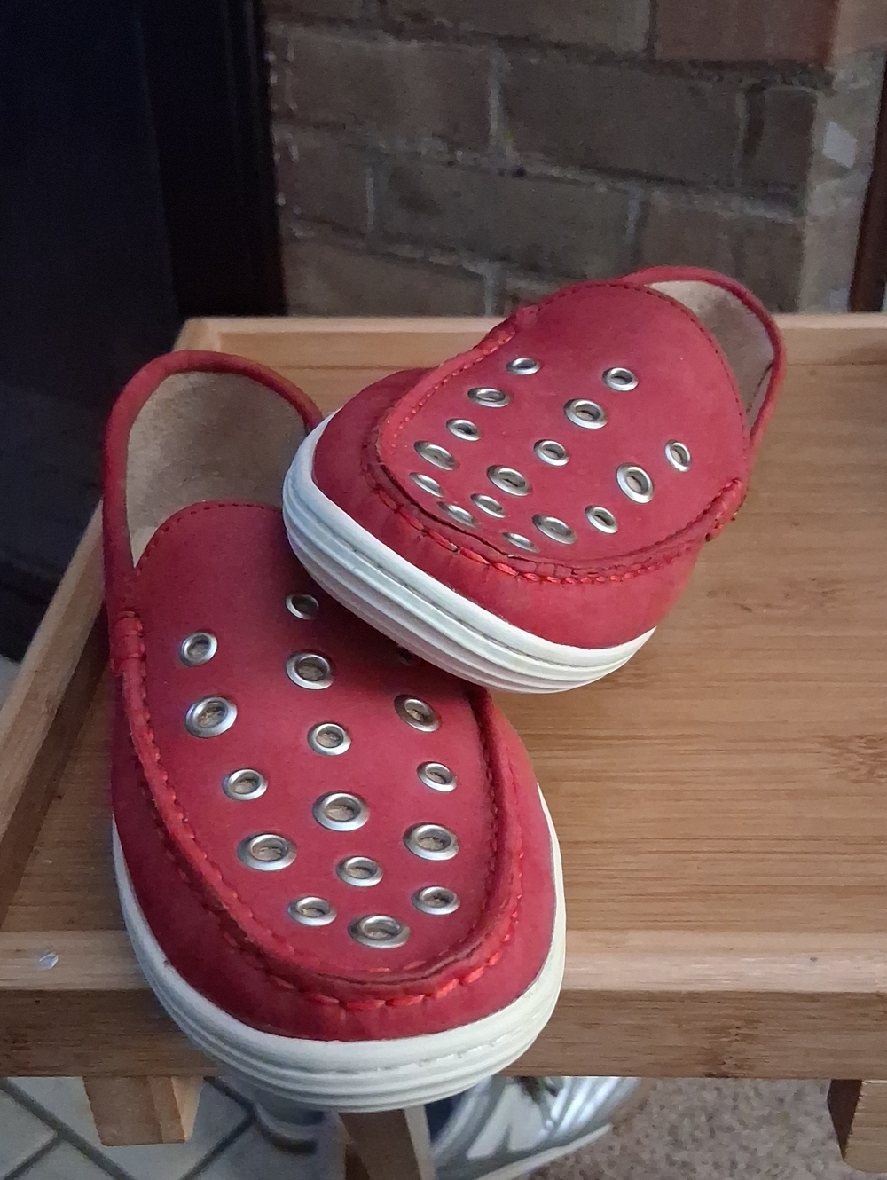Womens Size 6 Red Slip-On Shoes with Metal Eyelet Accent